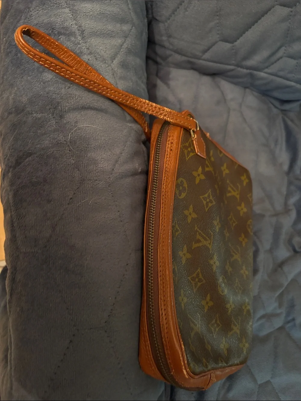 Louis Vuitton Brown Leather Monogram cosmetic case with wristlet strap.